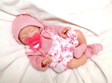 Realistic full silicone reborn baby doll, 13-inch preemie with closed eyes in pink outfit, handmade newborn therapy and collector doll